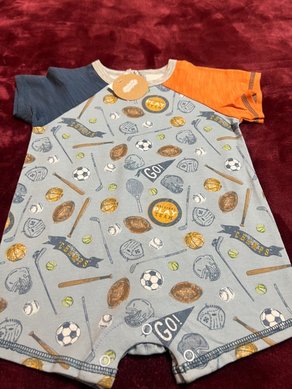 NWT Mudpie 6-9m one piece outfit. Sports themed.